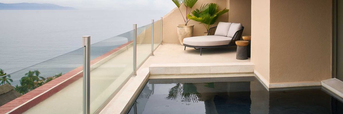 a balcony plunge pool with a view of the ocean
