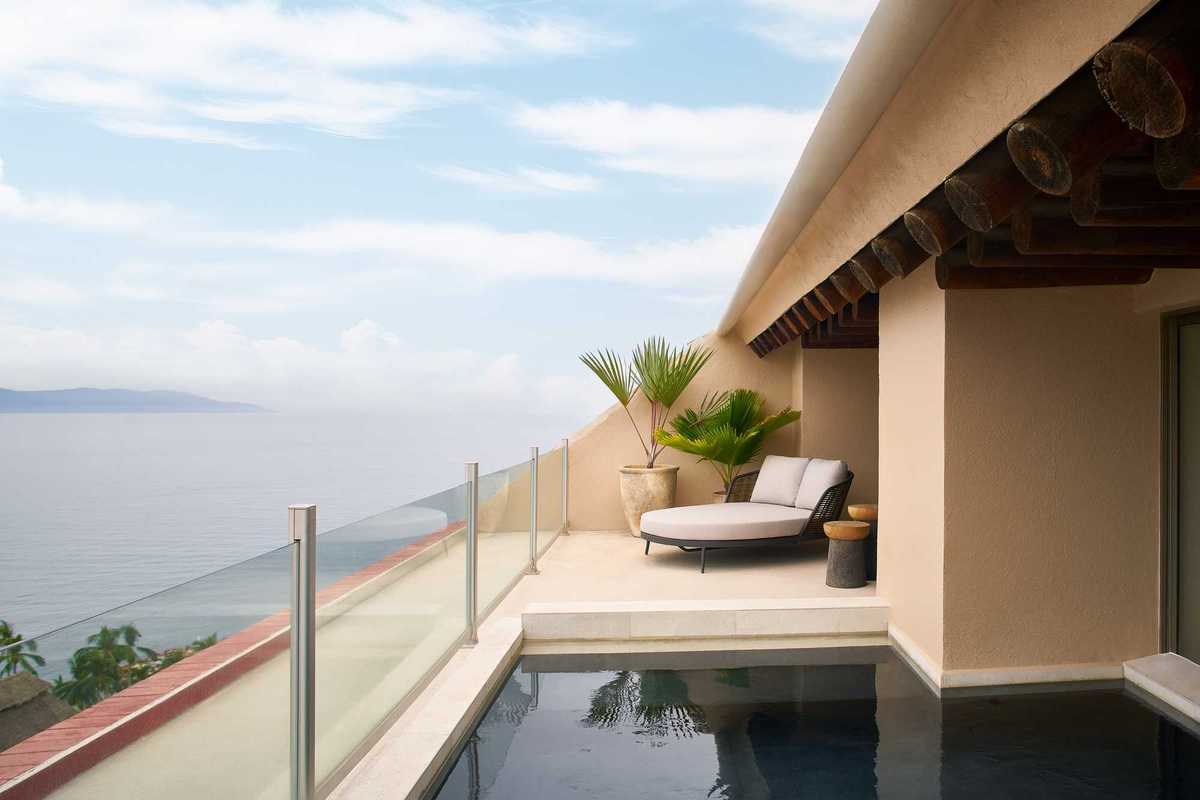 a balcony plunge pool with a view of the ocean