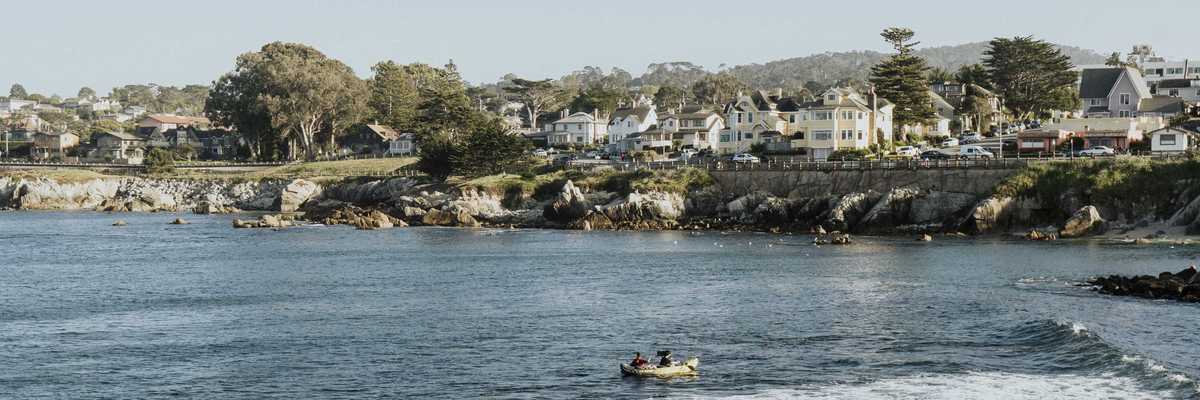 a beachside community with a rocky ocean