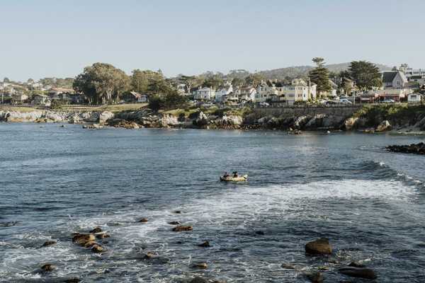 a beachside community with a rocky ocean