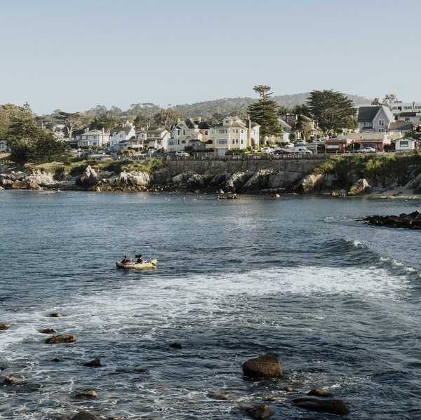 a beachside community with a rocky ocean