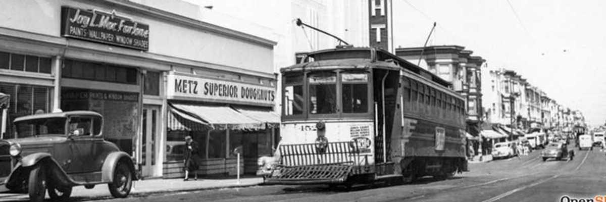 a black and white historical photo from the 1940s of San Francisco with a cable car
