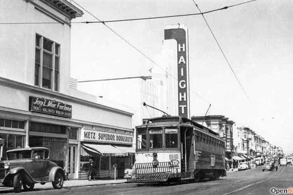 a black and white historical photo from the 1940s of San Francisco with a cable car
