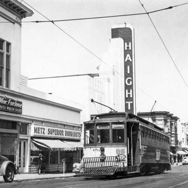 a black and white historical photo from the 1940s of San Francisco with a cable car