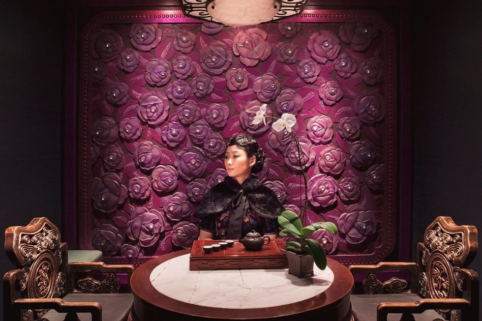 A Chinese woman in a lavish room
