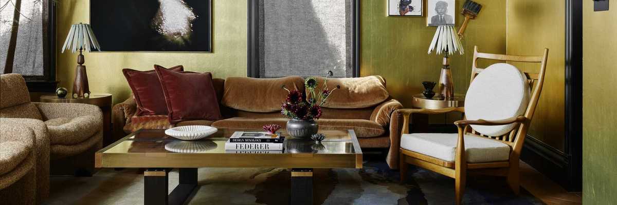 a curated living room with feathers on the upper walls