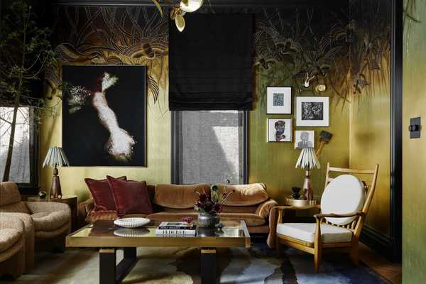 a curated living room with feathers on the upper walls