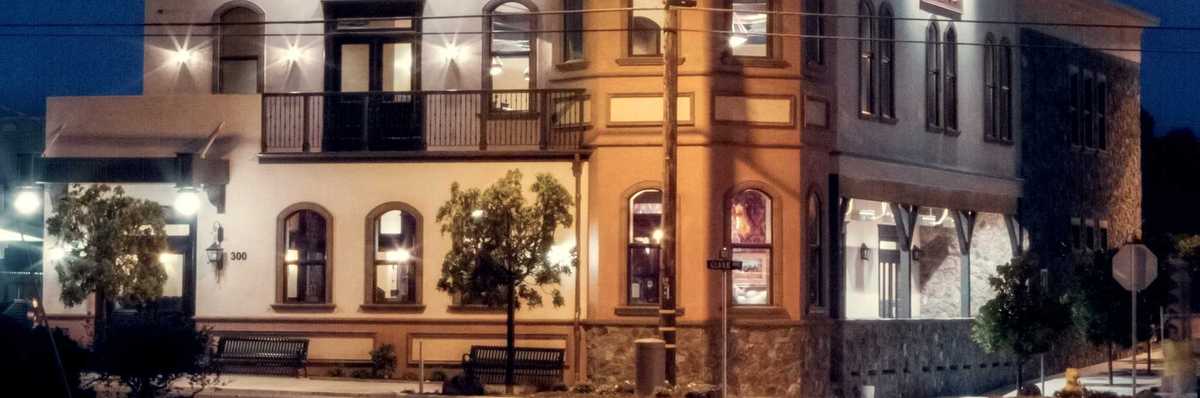 a historic looking tavern in the dark with shining light
