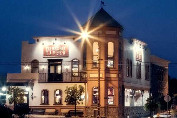 a historic looking tavern in the dark with shining light