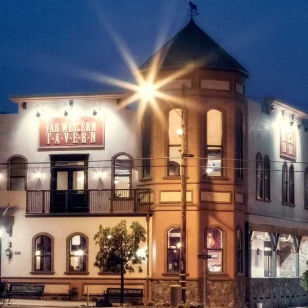 a historic looking tavern in the dark with shining light