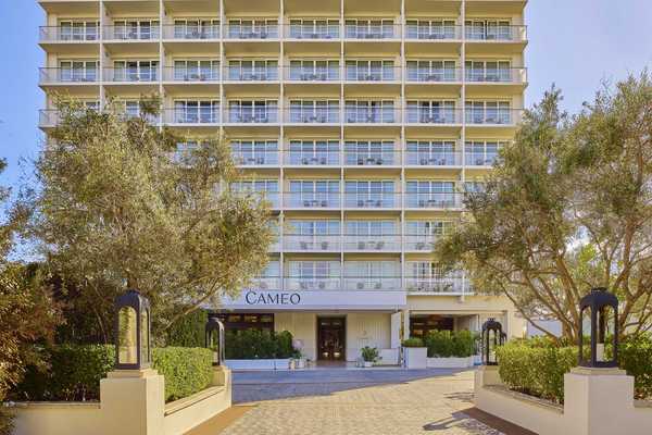 a md-century modern hotel with a grid of private patios