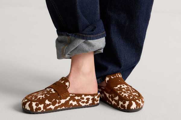 a pair of cow print velvety half loafer-half clog shoes