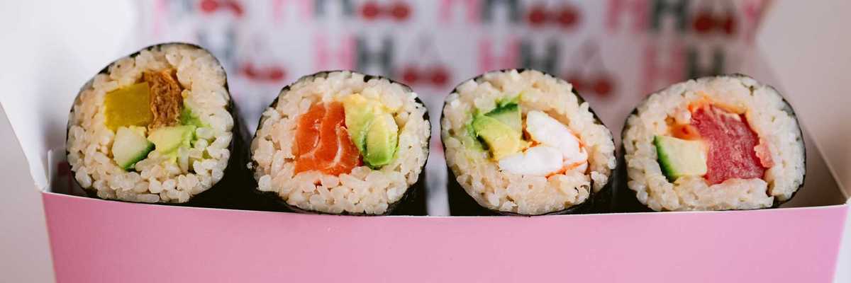 a pink box filled with Australian-style handrolls