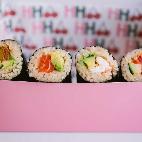 a pink box filled with Australian-style handrolls