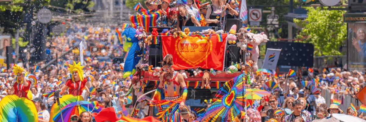 a Pride parade with tons of people in rainbow colors
