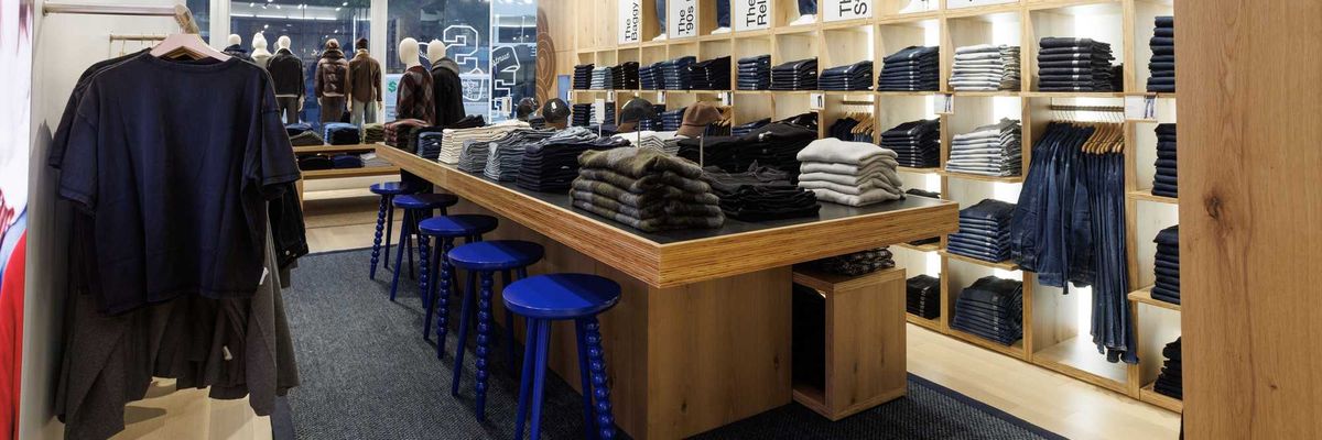 A store with a denim table and denim wall