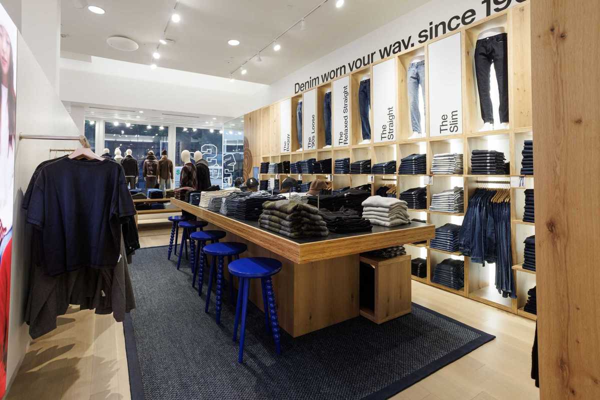 A store with a denim table and denim wall