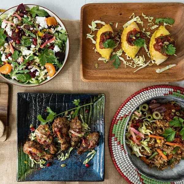 A table of dishes of food and a Senegalese flag