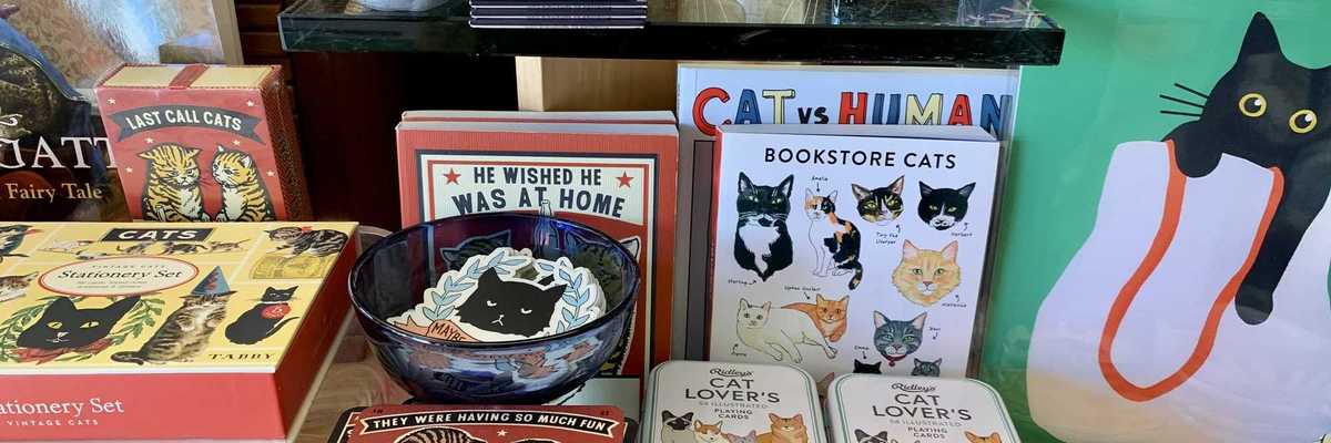 a table with cat-themed gifts