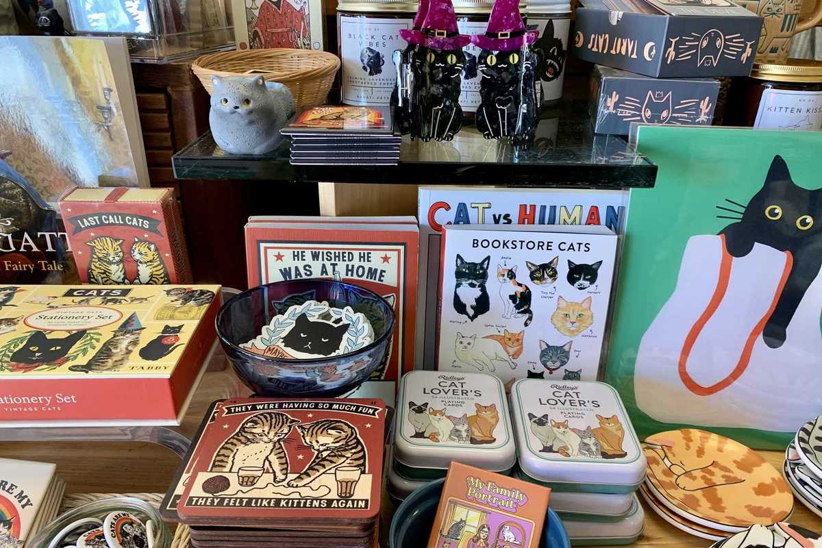 a table with cat-themed gifts