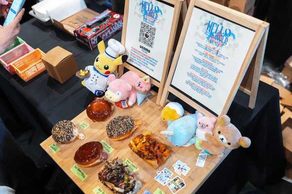 a table with Japanese sweets, pastries and stuffies