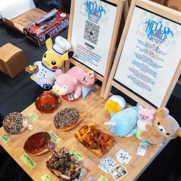 a table with Japanese sweets, pastries and stuffies