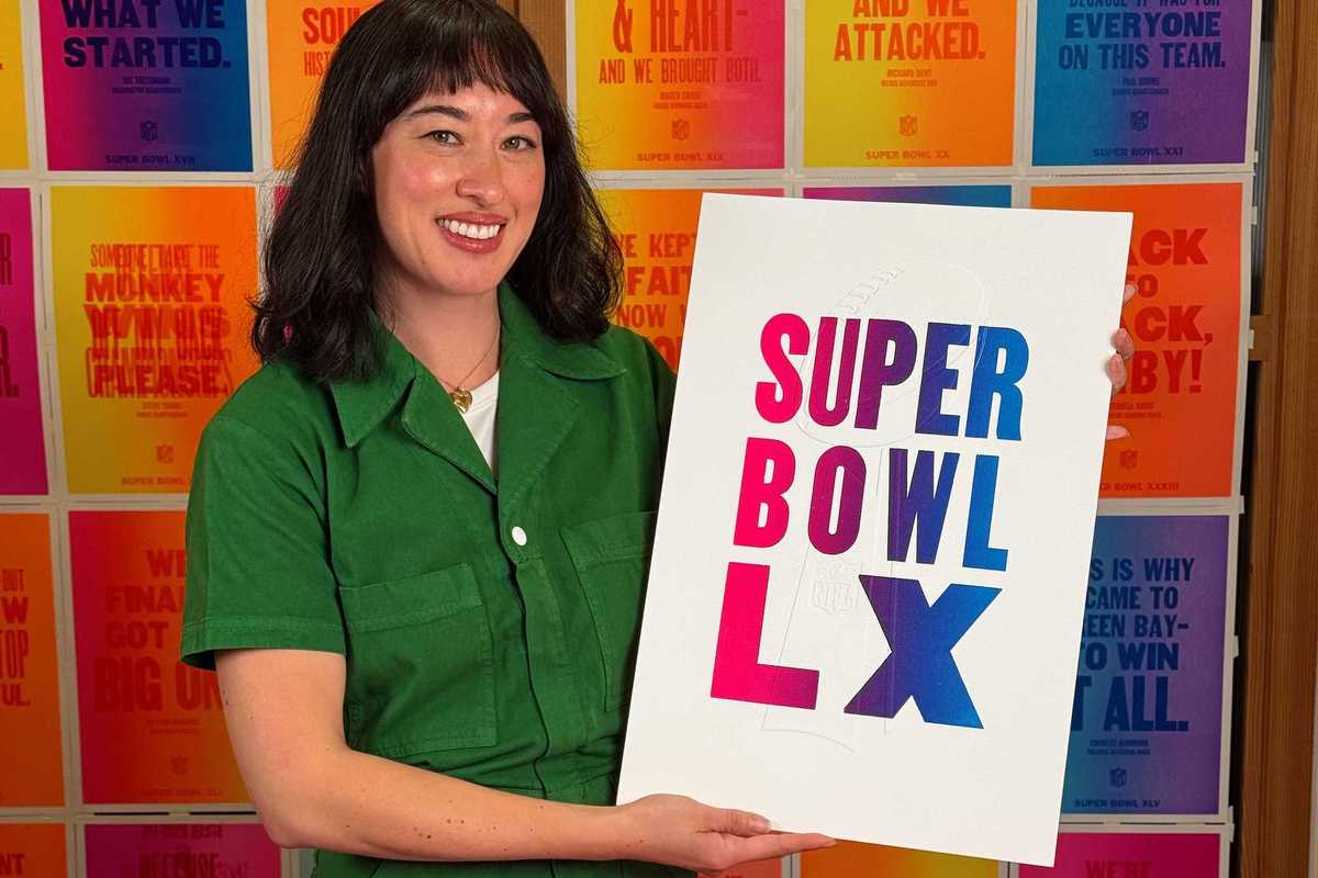 a woman in a green jumpsuit holding a super bowl lx poster