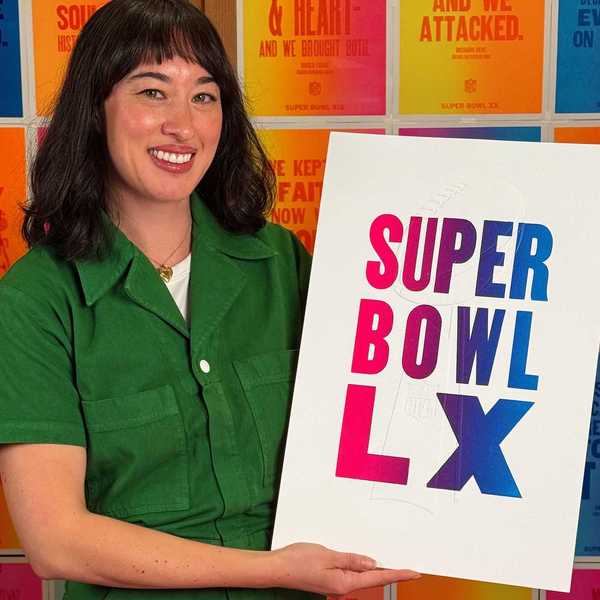 a woman in a green jumpsuit holding a super bowl lx poster