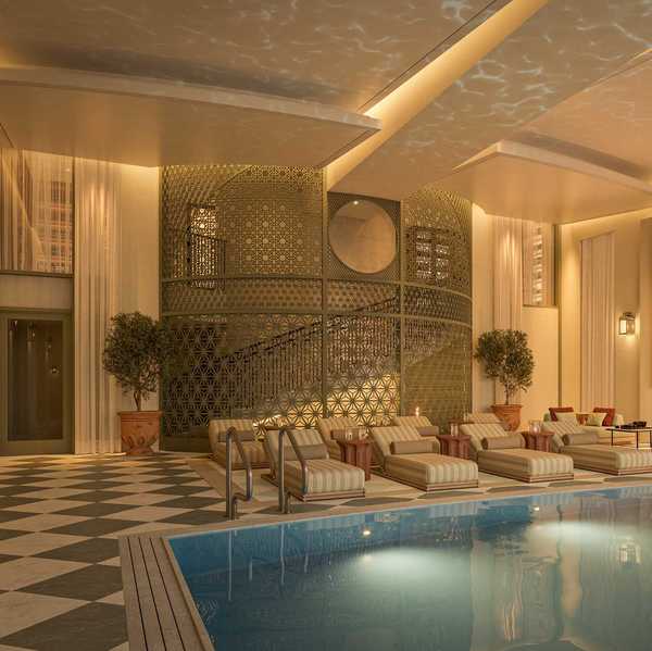 an Art Deco-inspired indoor pool with gilded accents and glamorous loungers