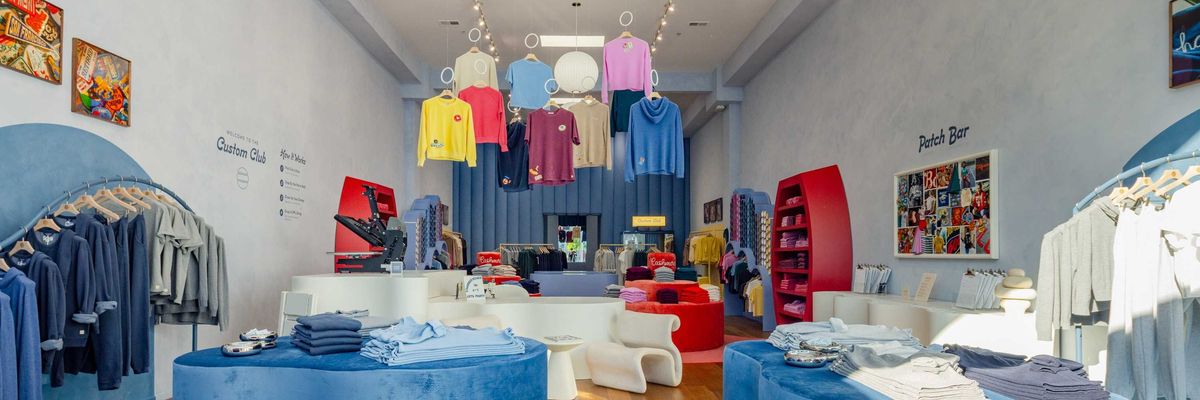 Bright, colorful clothing store interior with modern displays and hanging apparel.