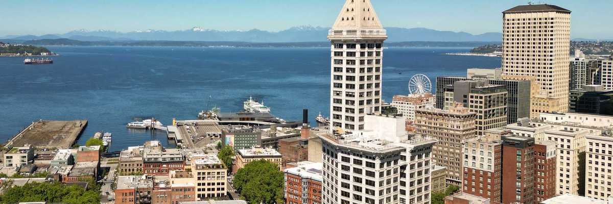buildings of downtown seattle with the bay in the background