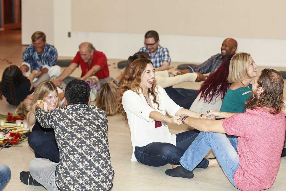 couples sitting on the floor doing a fun dating exercise