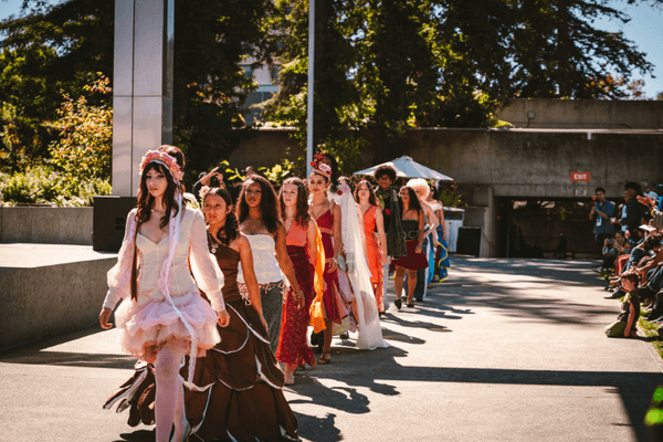 fashion models walking an outdoor runway