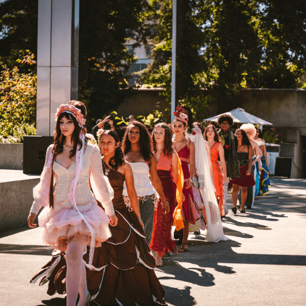 fashion models walking an outdoor runway