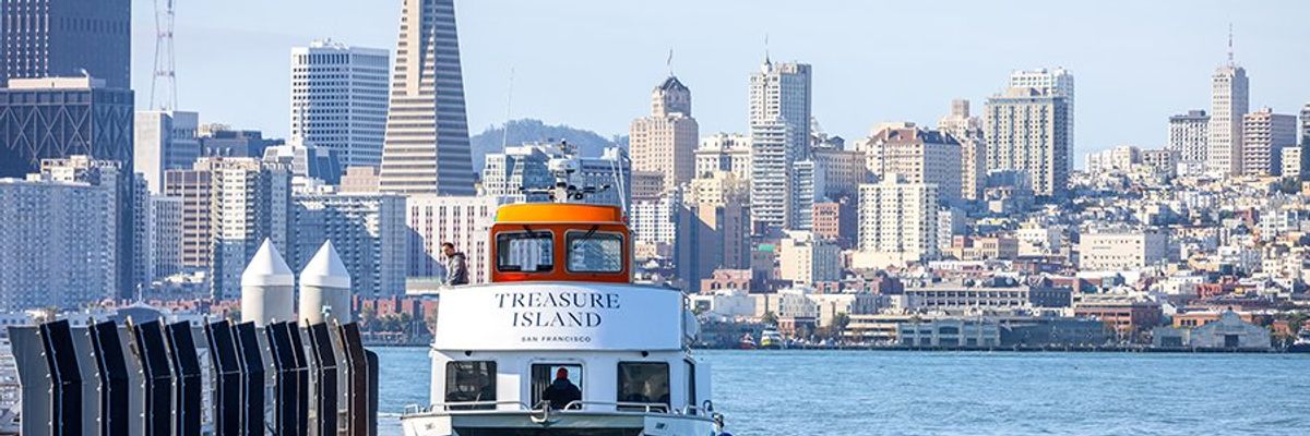 Ferry approaches San Francisco skyline with Transamerica Pyramid in view.