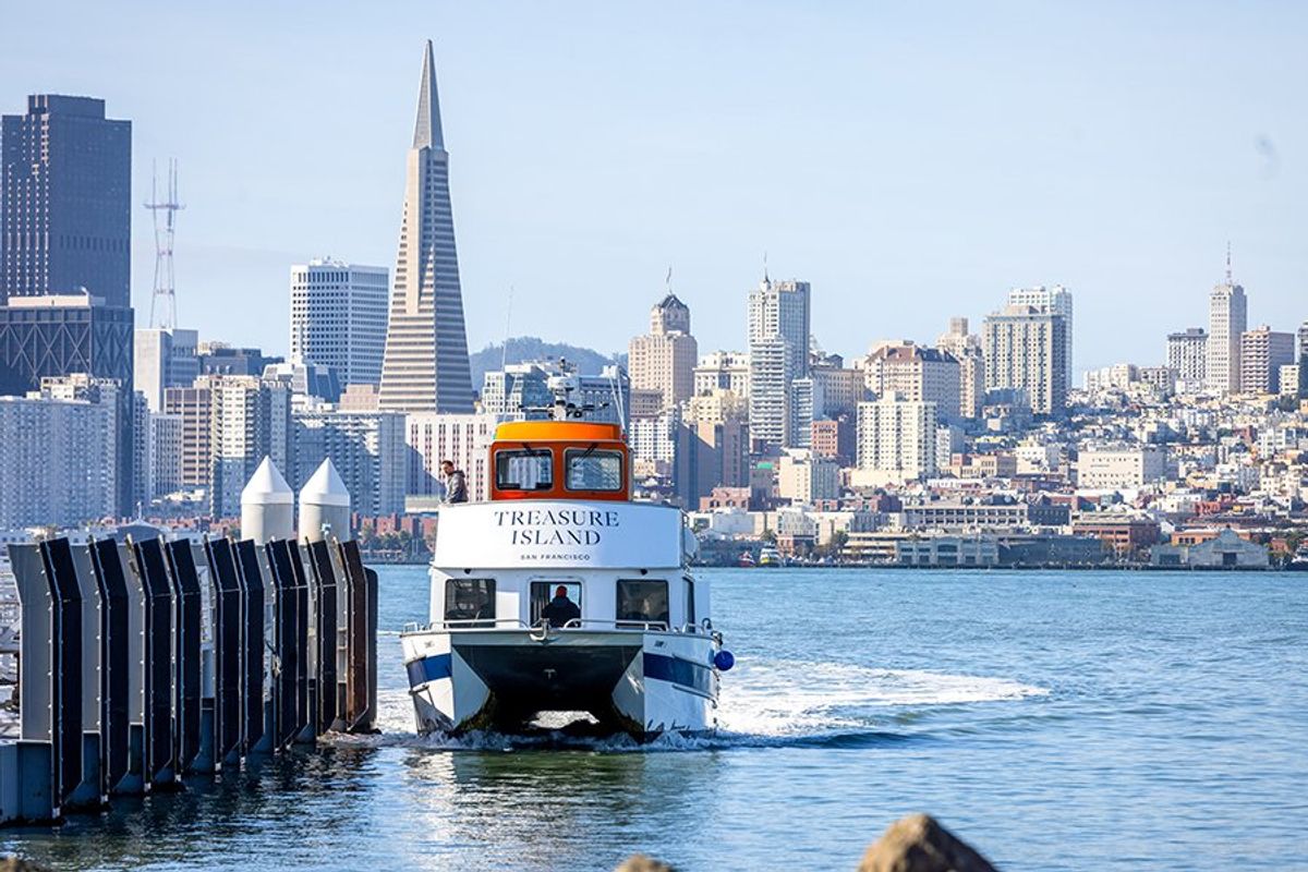 Ferry approaches San Francisco skyline with Transamerica Pyramid in view.