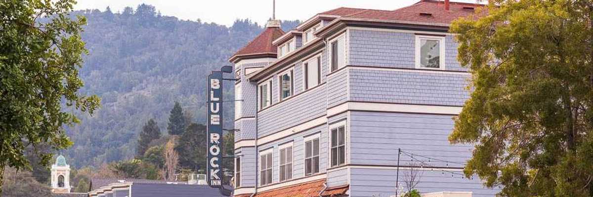historic downtown main street set against tree covered hills