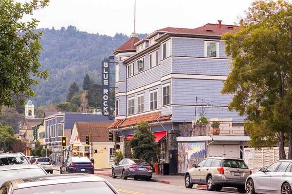 historic downtown main street set against tree covered hills