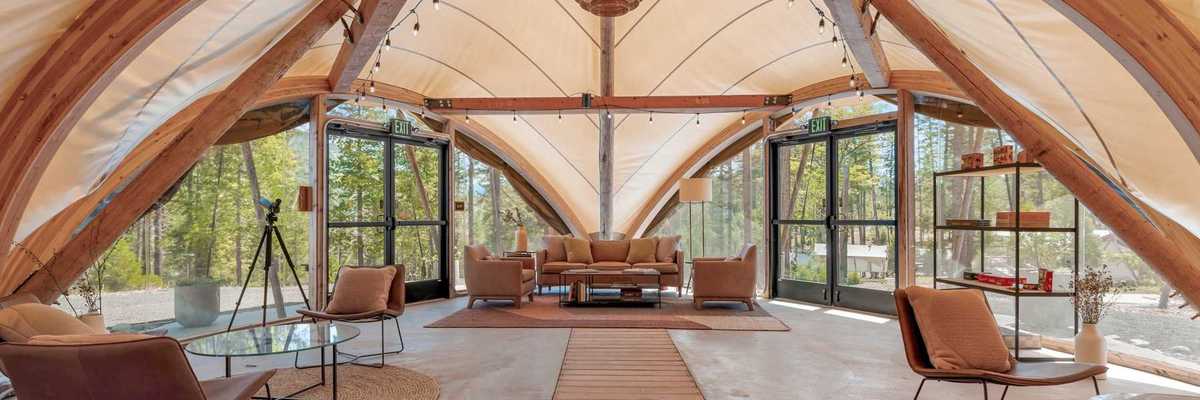inside a huge tent with lounges and seating areas