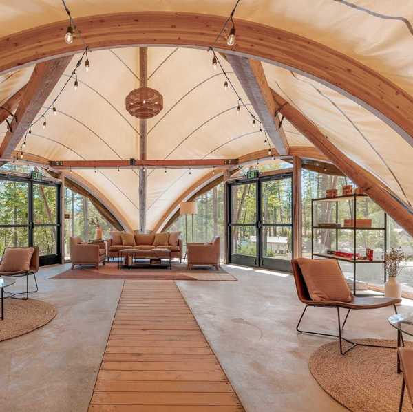 inside a huge tent with lounges and seating areas
