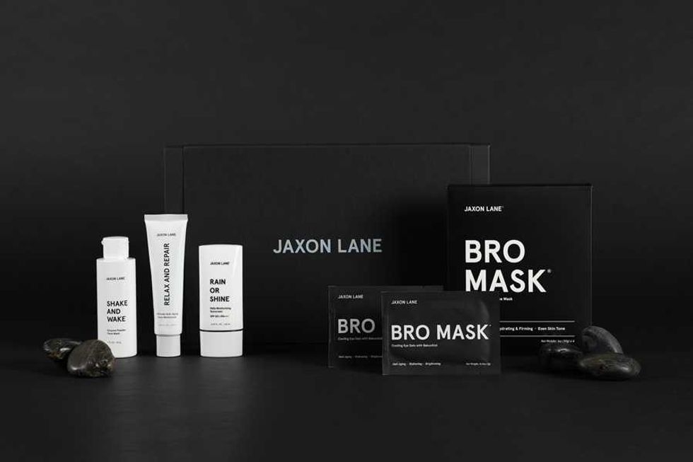 Jaxon Lane skincare products, including Bro Mask, on a black background.