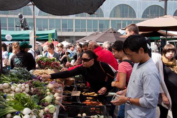 people buying produce at a farmers' market