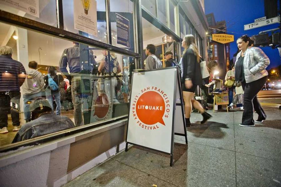 People entering a building for the San Francisco Litquake literary festival at night.