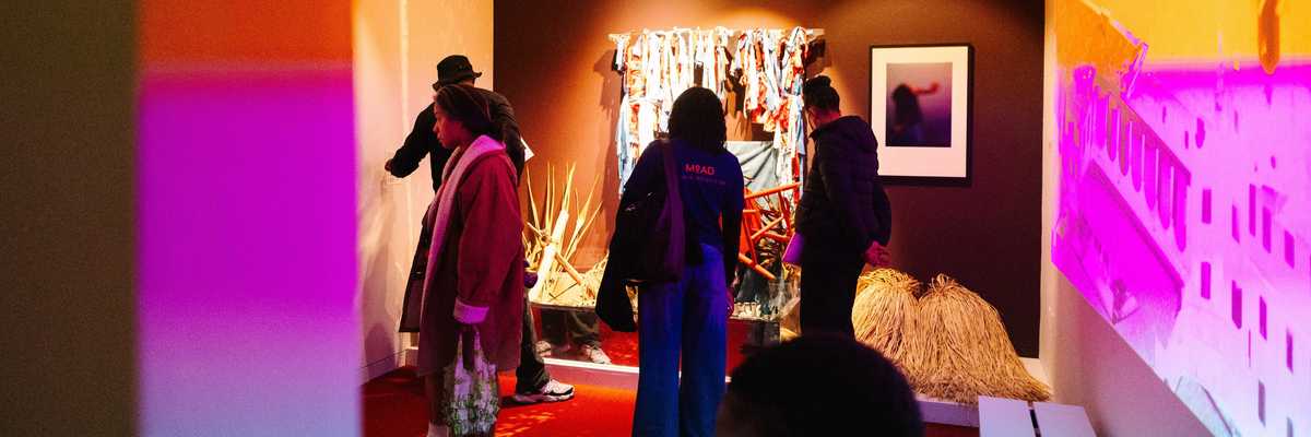 people in a gallery looking at art