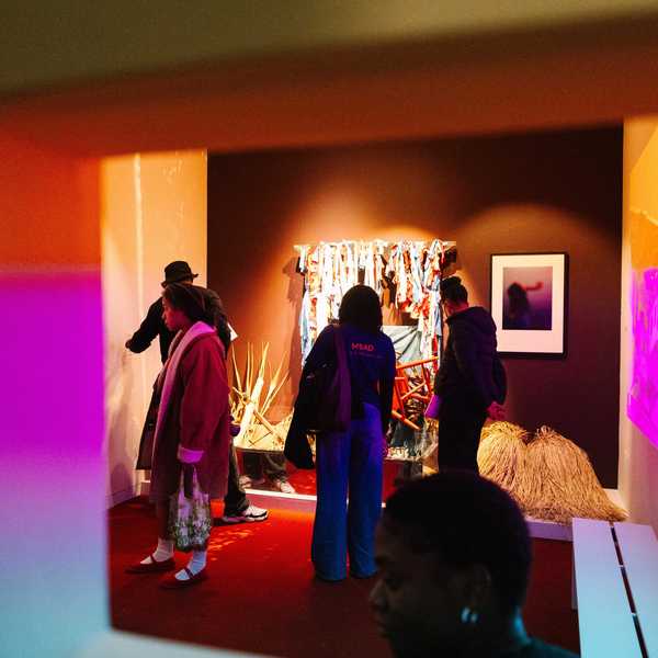 people in a gallery looking at art