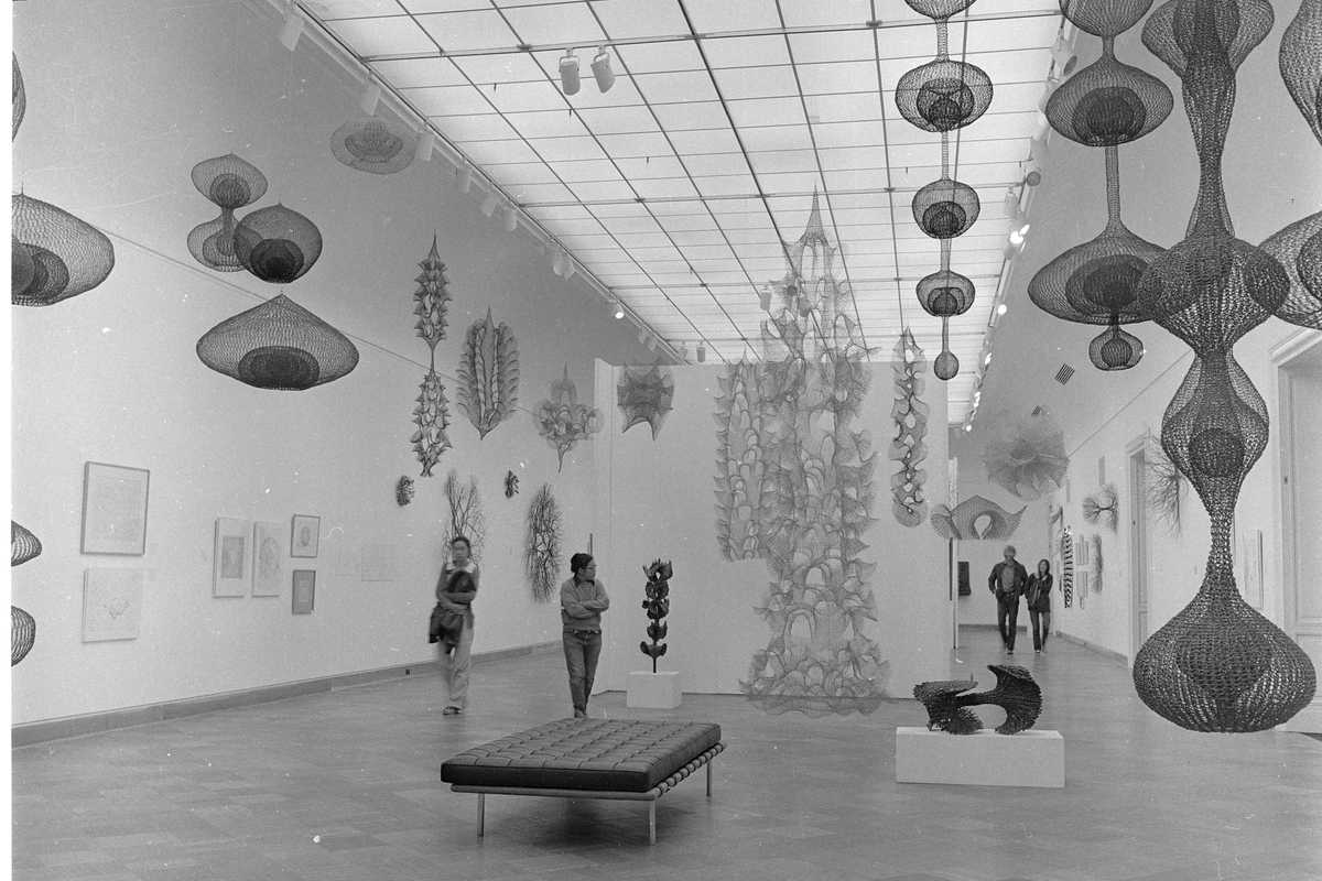 Ruth Asawa with visitors to her exhibition 'Ruth Asawa: A Retrospective,' at SFMOMA in 1973
