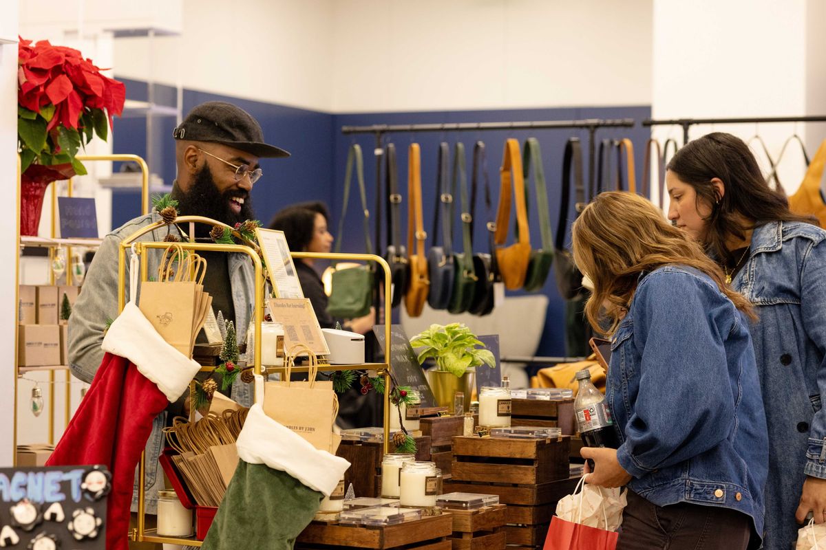 shoppers checking out at in a store decked for the holidays