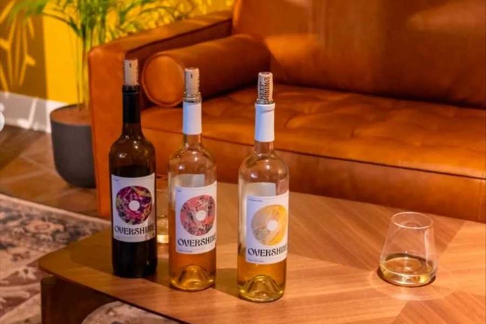 Three bottles of Overshine wine on a table