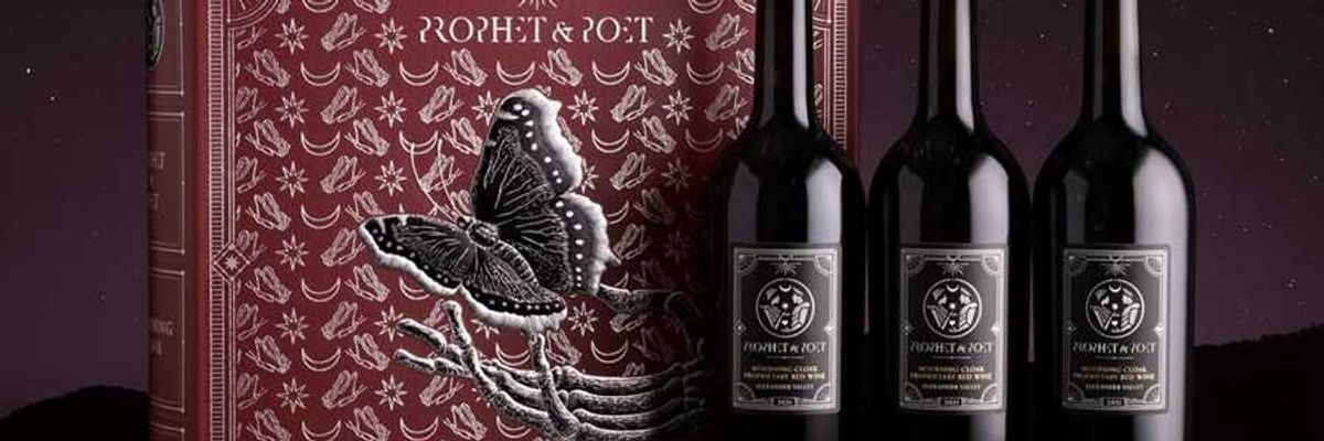 Three wine bottles beside a detailed red box with a butterfly design.