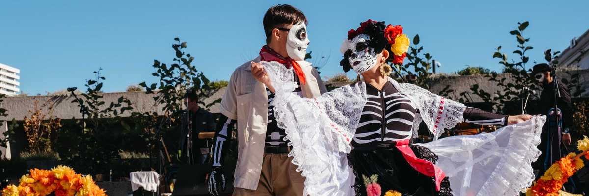 two people dressed as skeletons dancing